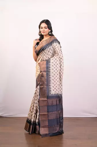 Offwhite and black  handloom tussar silk saree with golden zari border pallu