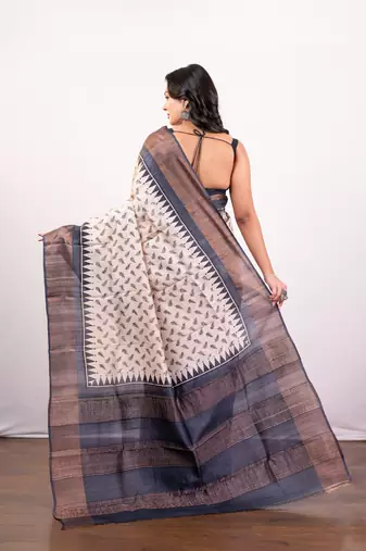 Offwhite and black  handloom tussar silk saree with golden zari border pallu