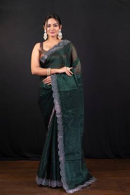 Dark green jimmy choo saree with intricate silver embellishments and beautiful curve border 1