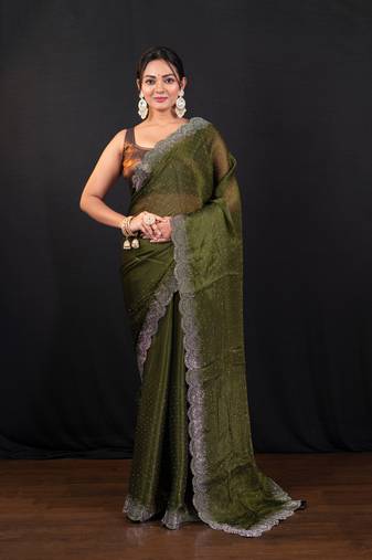Moss green jimmy choo saree with intricate silver embellishments and beautiful curve border