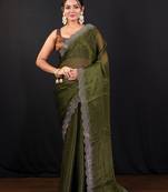 Moss green jimmy choo saree with intricate silver embellishments and beautiful curve border