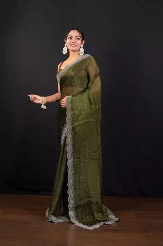 Moss green jimmy choo saree with intricate silver embellishments and beautiful curve border