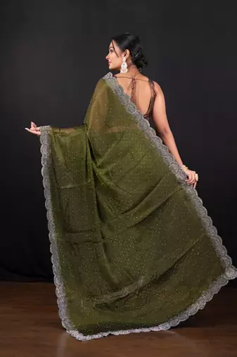 Moss green jimmy choo saree with intricate silver embellishments and beautiful curve border