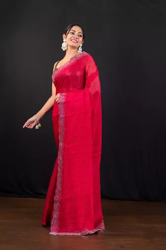 Red jimmy choo saree with intricate silver embellishments and beautiful curve border