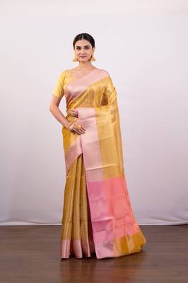 Gold tissue art silk saree with detailed pink zari border 1