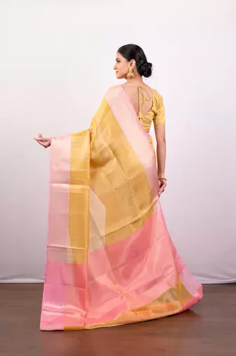 Gold tissue art silk saree with detailed pink zari border