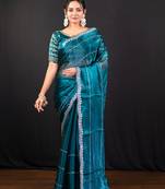 Teal blue jimmy choo saree with intricate silver embellishments and blouse