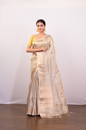 Golden beige tissue art silk saree with golden border