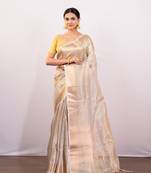 Golden beige tissue art silk saree with golden border