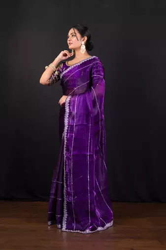 Dark purple jimmy choo saree with intricate silver embellishments and ready blouse