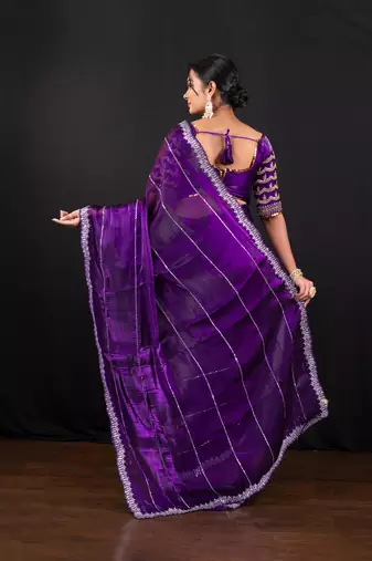 Dark purple jimmy choo saree with intricate silver embellishments and ready blouse