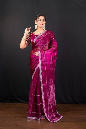 Magenta jimmy choo saree with intricate silver embellishments and ready blouse