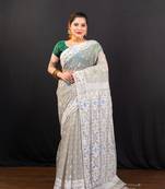 Grey cotton jamdani saree with offwhite  woven motifs