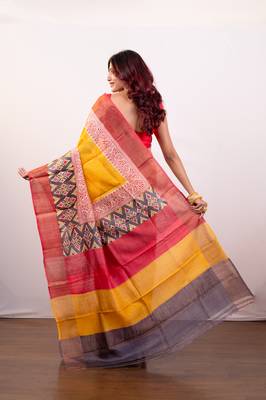 Yellow handpainted  tussar silk saree with red alpana design and multi pallu 3