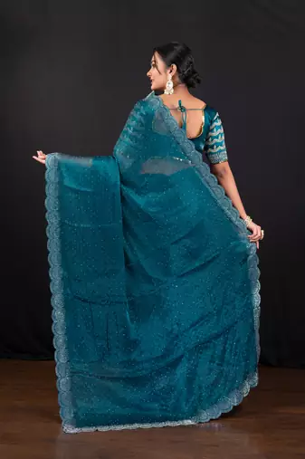 Teal blue jimmy choo saree with intricate silver embellishments and beautiful curve border