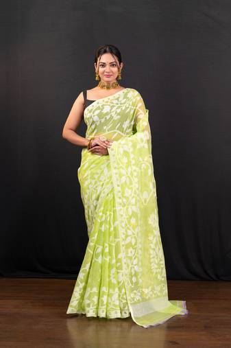 Bright green cotton jamdani saree with offwhite leaf jaal motifs