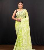 Bright green cotton jamdani saree with offwhite leaf jaal motifs