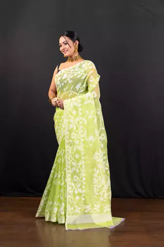 Bright green cotton jamdani saree with offwhite leaf jaal motifs