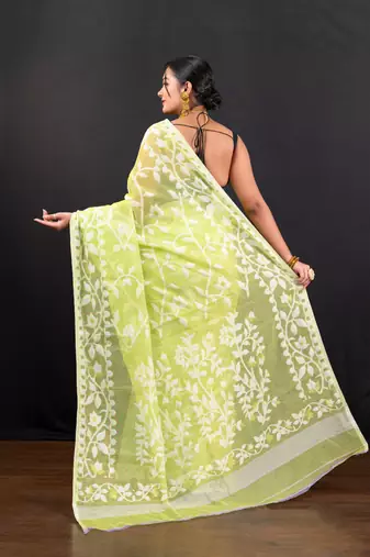 Bright green cotton jamdani saree with offwhite leaf jaal motifs