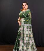 Dark green cotton jamdani saree with offwhite  woven motifs