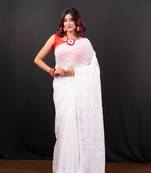 White cotton jamdani saree with self woven motifs and golden booti