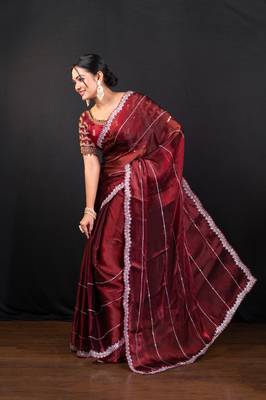 Maroon jimmy choo saree adorned with intricate silver embellishments and a beautifully detailed border with ready blouse 2