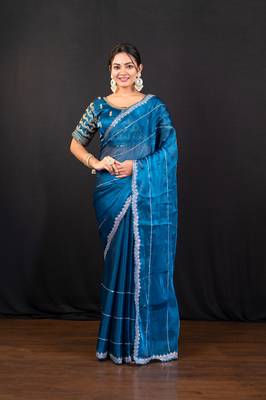 Blue jimmy choo saree adorned with intricate silver embellishments and a beautifully detailed border with ready blouse 1