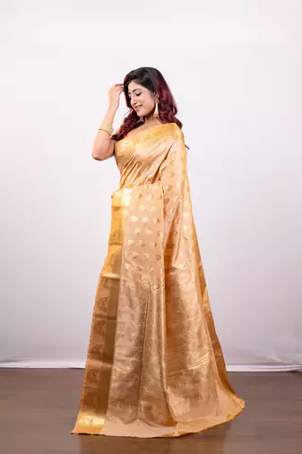 Kanjivaram art silk blend saree in peach cover floral motifs and border