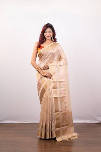 Beige organza art silk saree with golden zari floral border