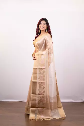 Beige organza art silk saree with golden zari floral border