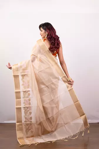 Beige organza art silk saree with golden zari floral border
