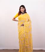 Beige cotton jamdani saree with yellow leaf jaal motifs