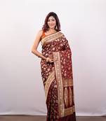 Maroon pure banarasi katan silk saree with golden floral jaal motifs and golden border pallu