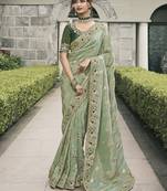 Sea green viscose tussar  jacquard with anmol jari half-half saree