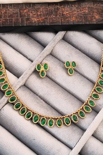 Traditional gold-plated necklace set with oval green gemstones, matching earrings