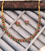 Traditional gold-plated necklace set with ruby red and emerald green stones, matching earrings
