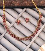Traditional gold-plated necklace set with ruby red stones, oval design, matching earrings