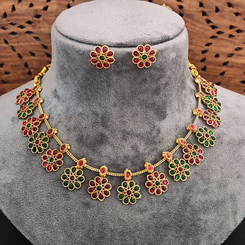 Traditional gold-plated floral necklace set with ruby and emerald stones, flower design earrings