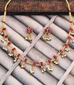Traditional gold-plated necklace set with ruby red stones, pearl drops, green beads and matching earrings