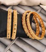 Gold-plated bangles set with floral design, red and green stones, set of 4