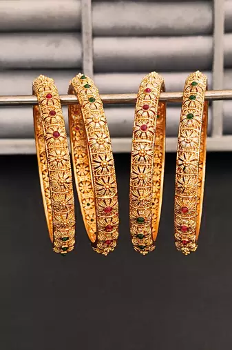 Gold-plated bangles set with floral design, red and green stones, set of 4