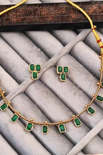 Elegant emerald gold necklace and earrings set, traditional indian jewellery with green stones