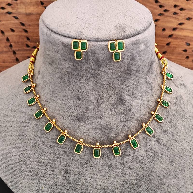 Elegant emerald gold necklace and earrings set, traditional indian jewellery with green stones