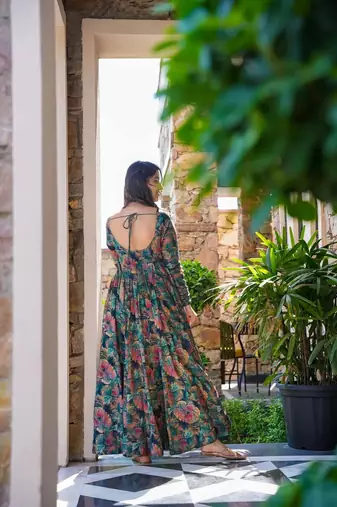 Teal partywear printed gown for trendy looks