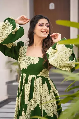 Green partywear printed gown for trendy looks