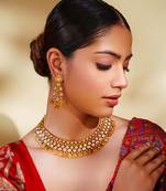 Dramatic and stylish kundan polki set with matching earrings