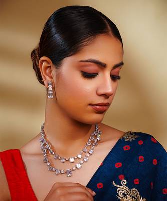 Delicate yet elegant diamond necklace in white finish with matching earrings 1