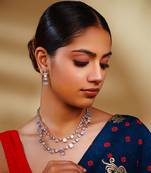 Delicate yet elegant diamond necklace in white finish with matching earrings