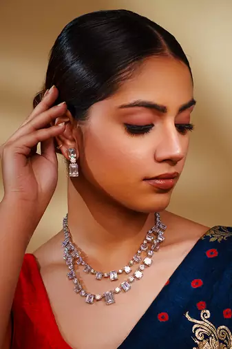 Delicate yet elegant diamond necklace in white finish with matching earrings
