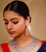 Delicate yet elegant diamond necklace in white finish with matching earrings